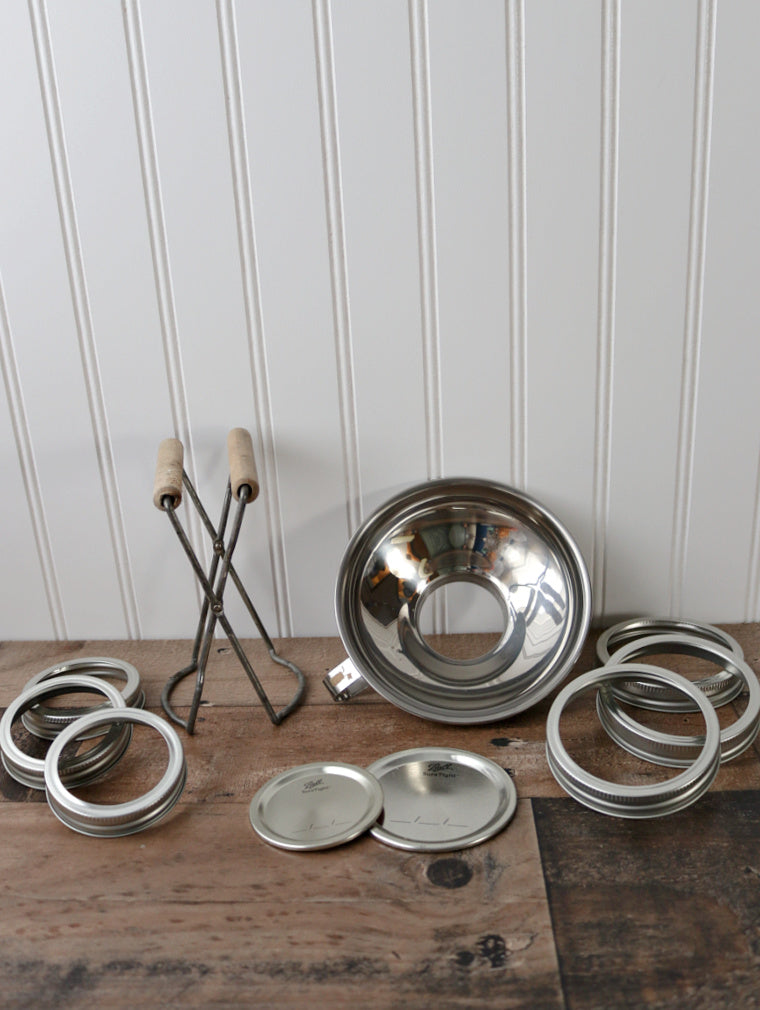 regular and wide mouth tin bands and flat lids, stainless steel canning funnel, and ball jar lifter