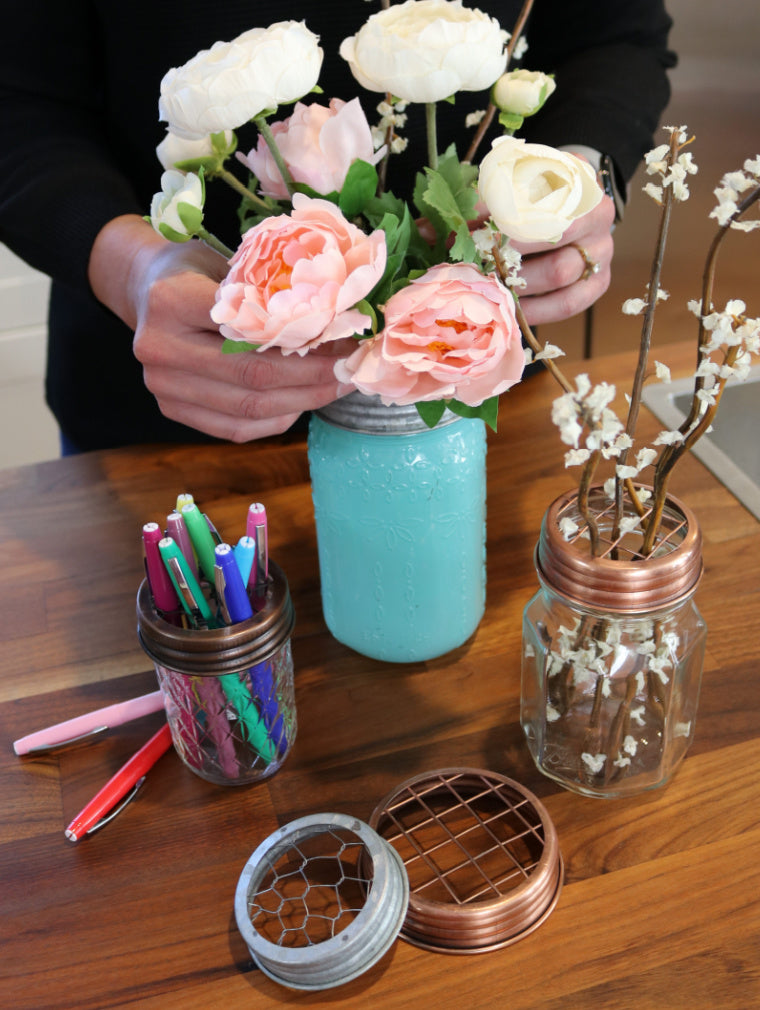 regular and wide mouth flower/frog organizer lids in galvanized, oil rubbed bronze, and shiny copper finishes in use