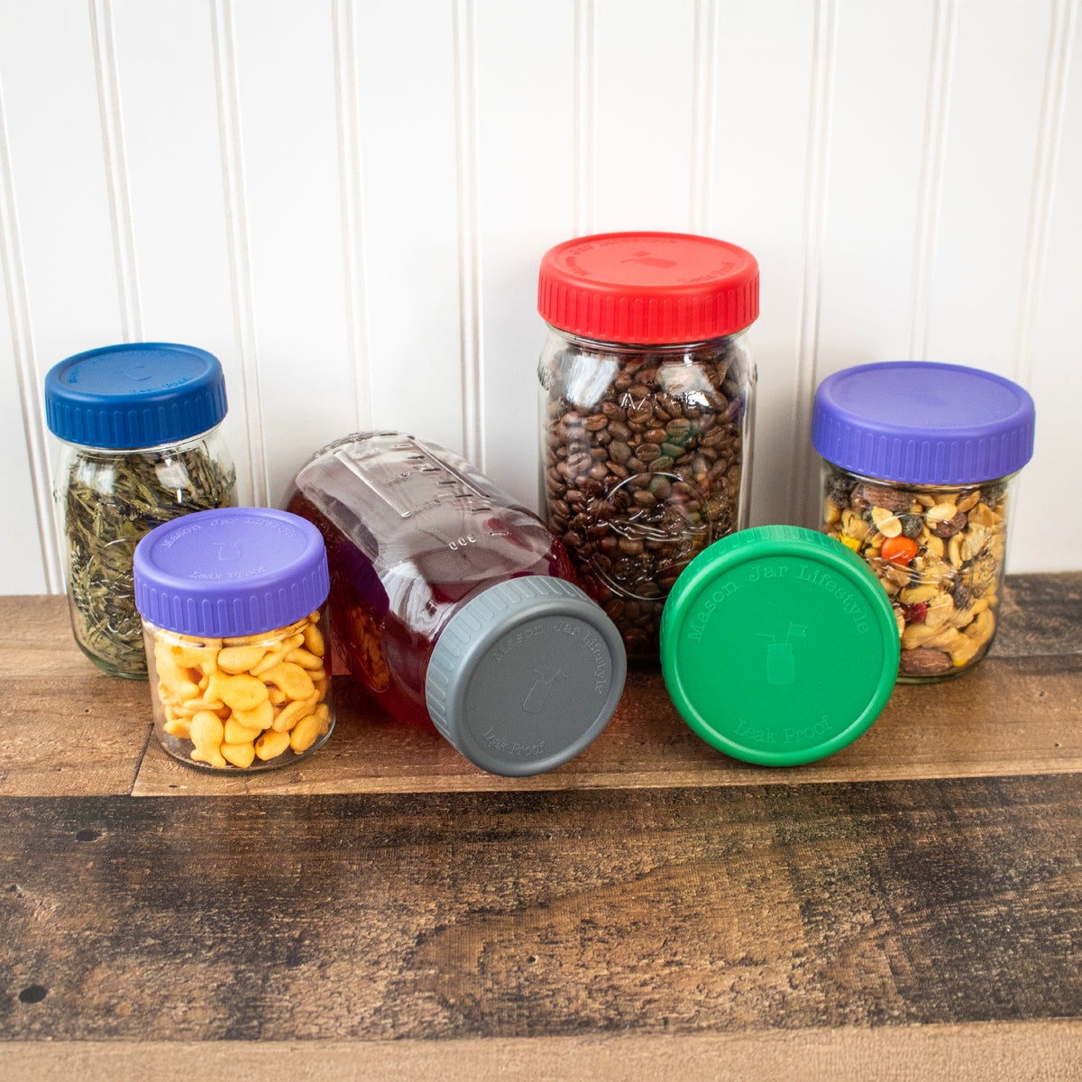 Plastic storage lids on different sized Mason jars, 16oz and 32oz.