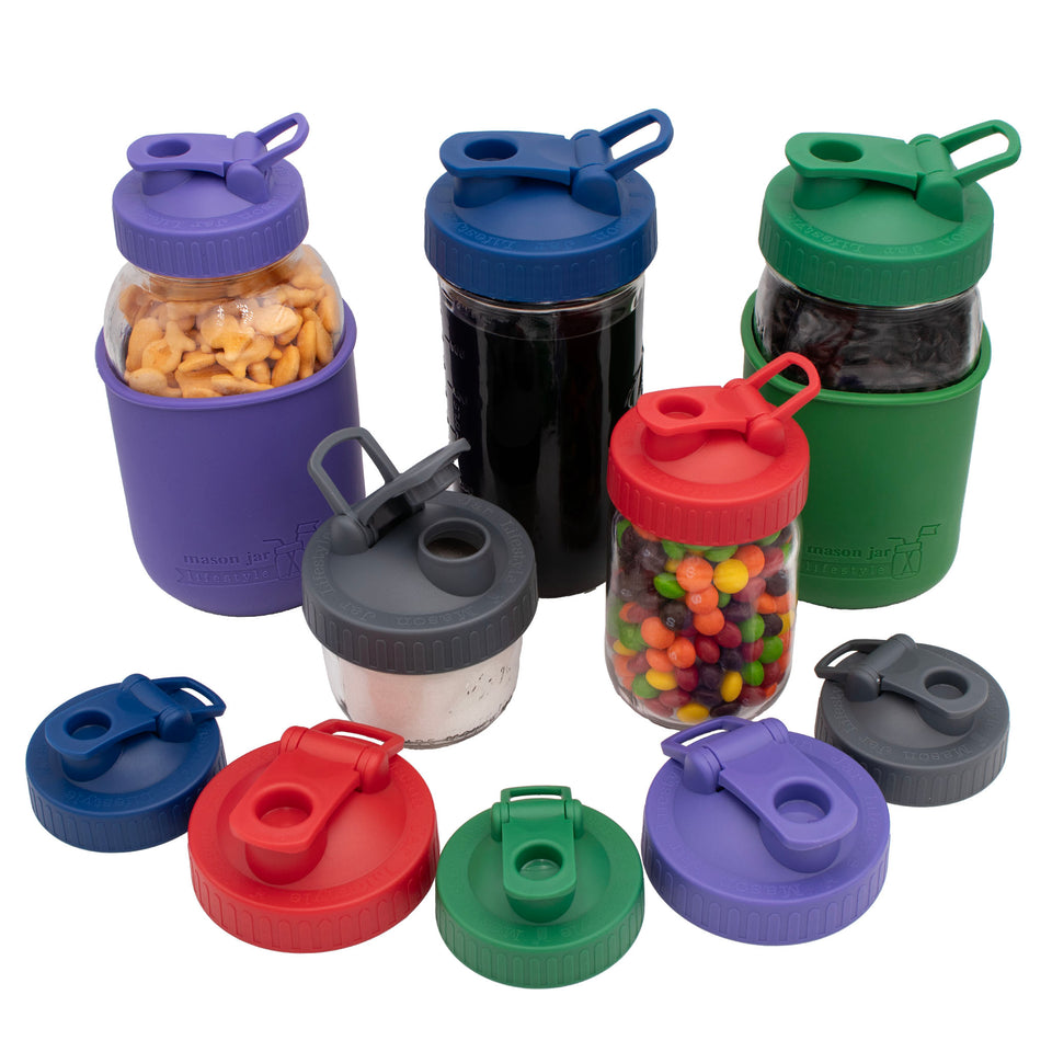 Regular and Wide Mouth Pour & Store shaker lids with carry loops in Cherry Red, Charcoal Gray, Deep Blue, Leaf Green, and Ultra Violet, shown alone and on Mason jars.
