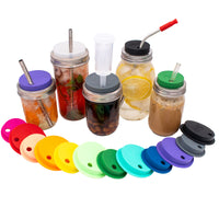 Regular and wide mouth silicone straw-hole lids with stainless steel bands, shown on Mason jars with straws and an airlock.